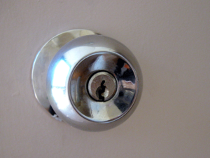 A classic round doorknob with a keyhole in the center. 